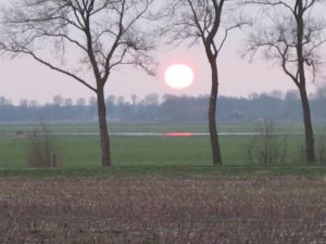 Zonsondergang bij Basse